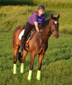 Amy Cone of Bellevue, IA, rides Snapphok, a former racehorse adopted through the Galloping Out program. 